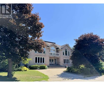 A large house with a driveway in front of it.