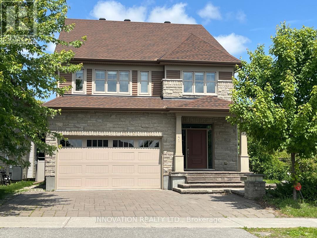 A house with a brown roof and a garage door.