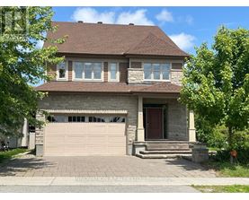A house with a brown roof and a garage door.