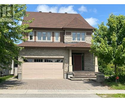 A house with a brown roof and a garage door.