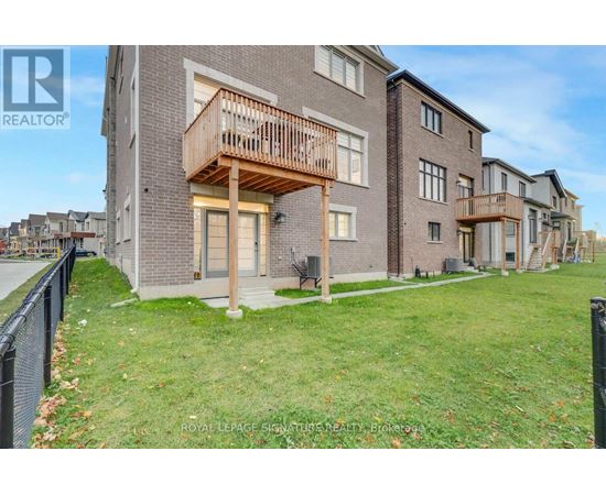 A building with a balcony is for sale.