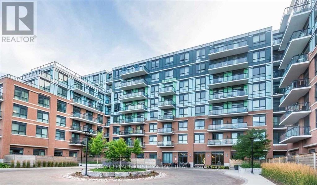 A large apartment complex with a courtyard in the middle.