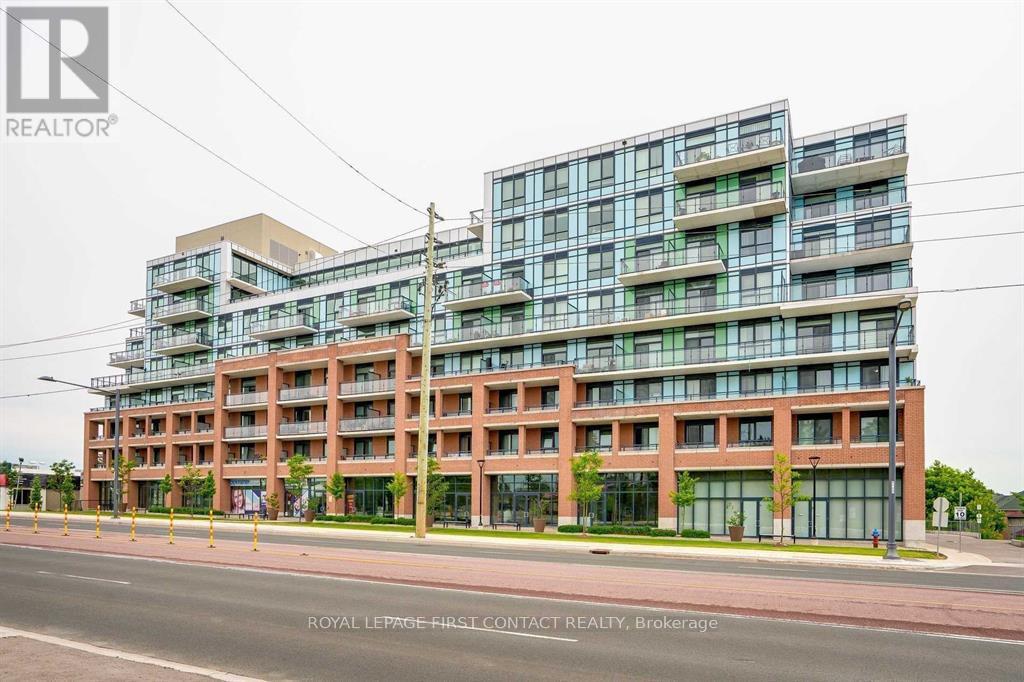 A modern multi-story building with a glass facade is the main focus of the image.