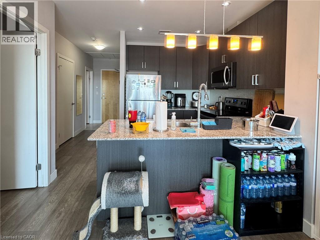 A kitchen with a counter and a chair.