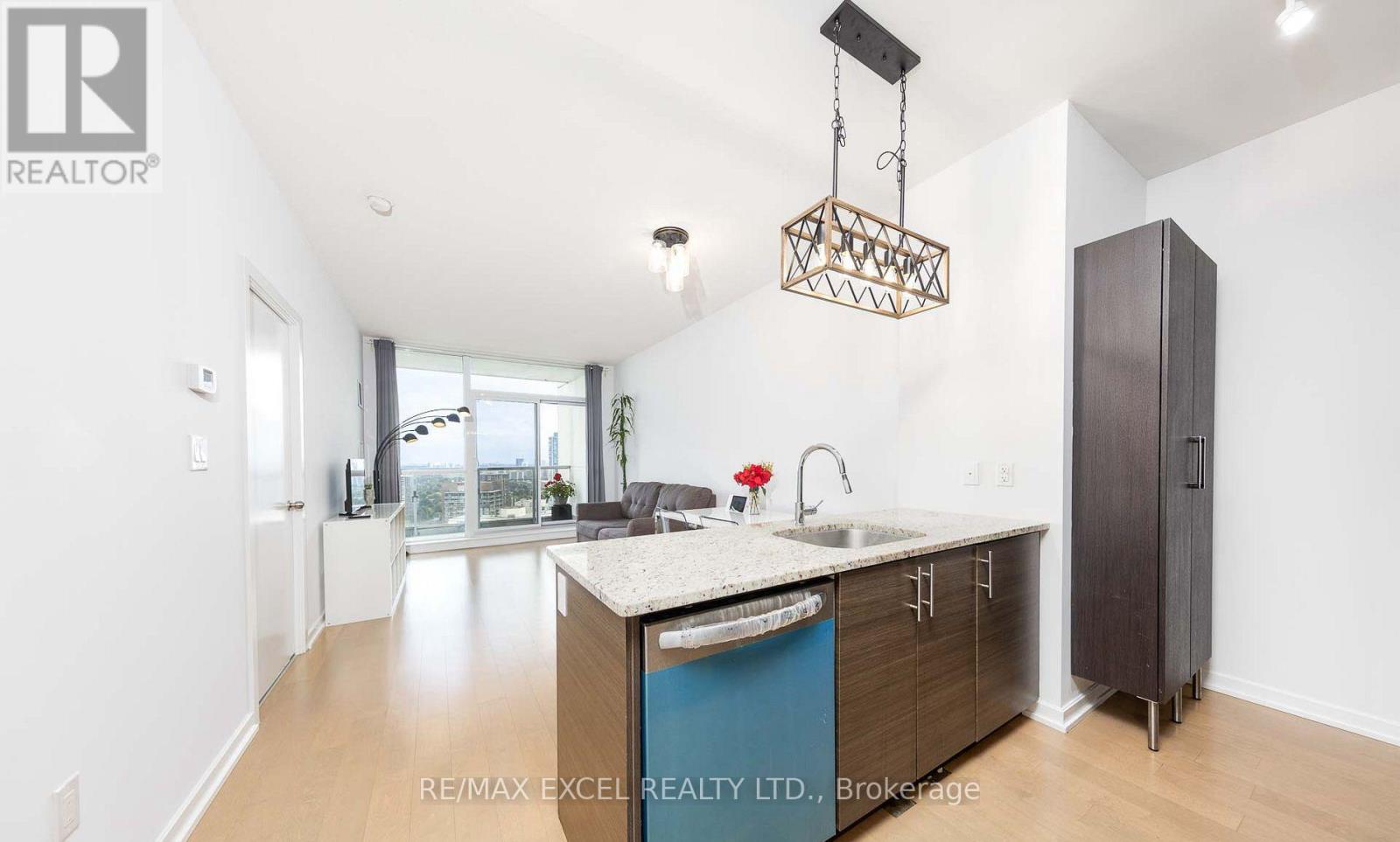 A kitchen with a blue island and wooden cabinets.