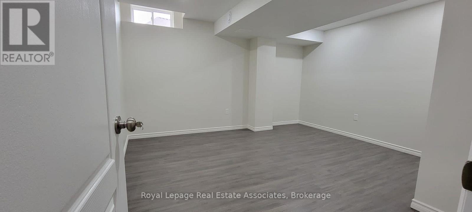 A room with a door and a sign that says REALTOR.