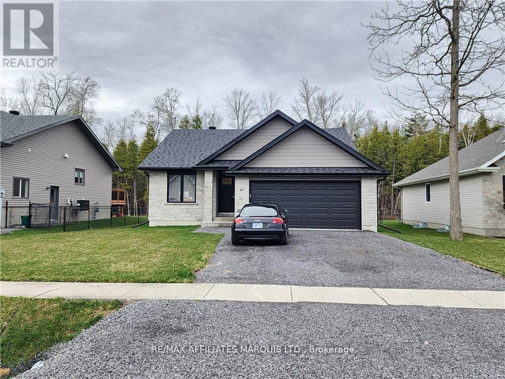 A house with a grey roof and a car parked in front.