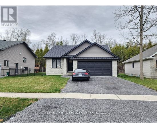 A house with a grey roof and a car parked in front.
