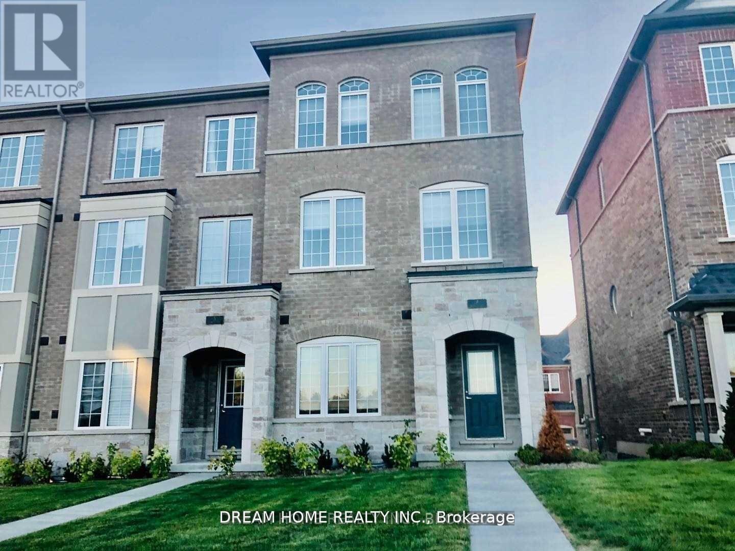 A building with the sign "Dream Home Realty Inc. Brokerage" in front of it.