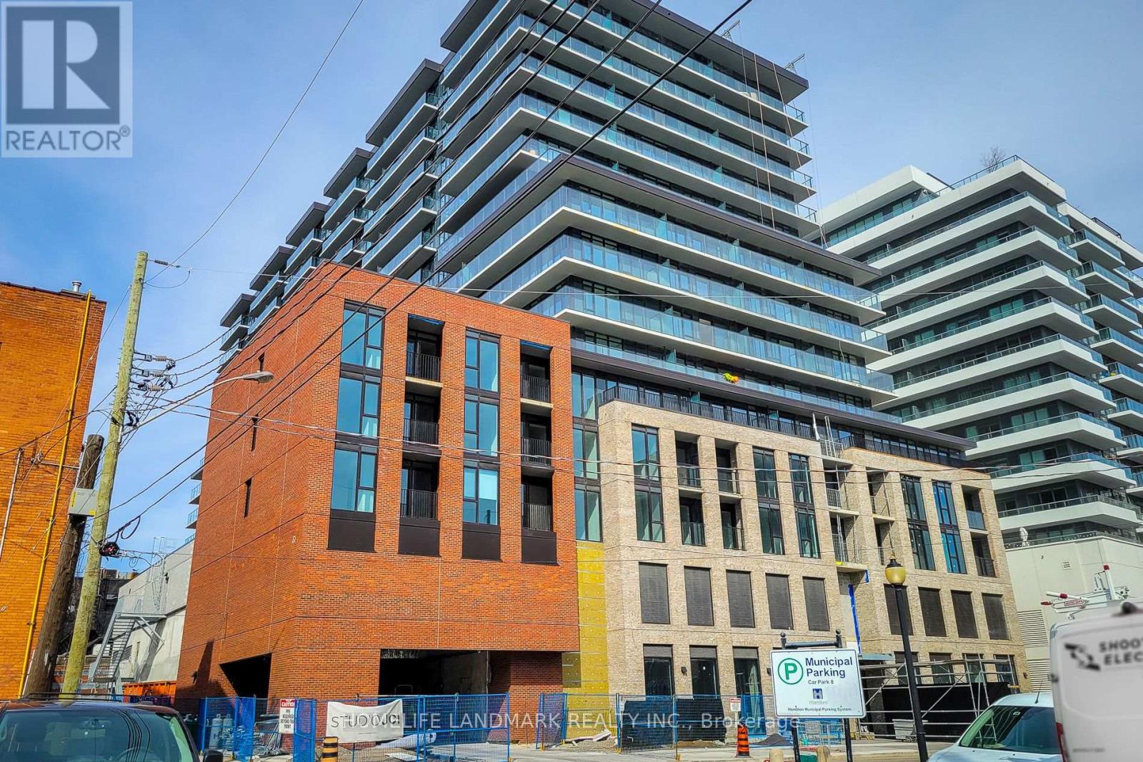 A tall building with a sign that says "REALTOR" on it.