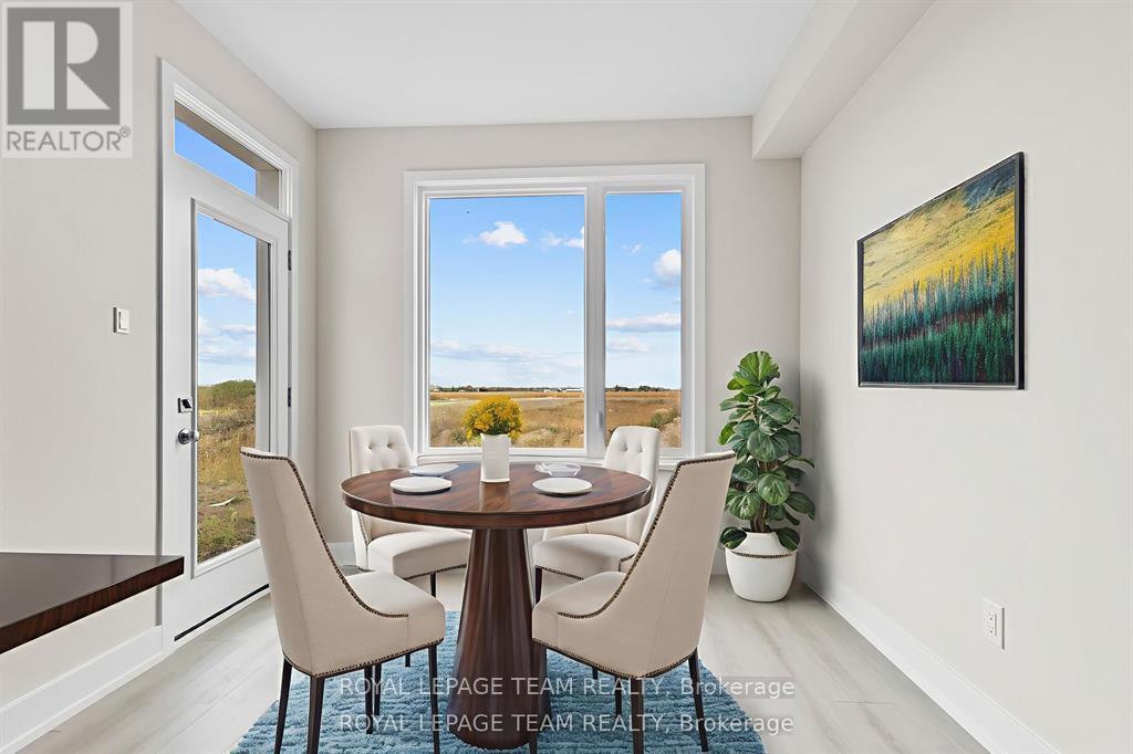 A dining room with a table set for four.