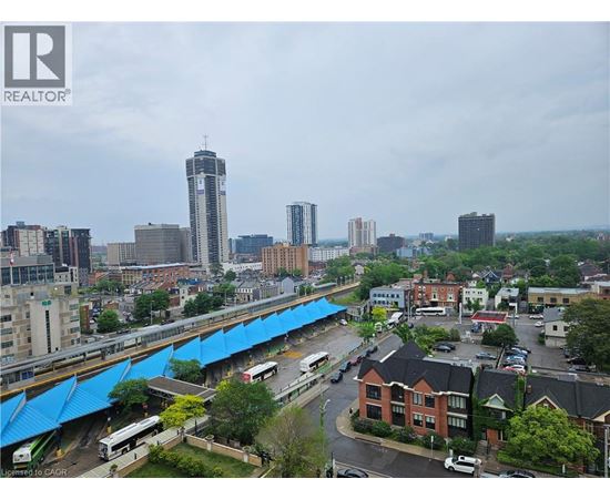 A cityscape with a bridge and buildings.