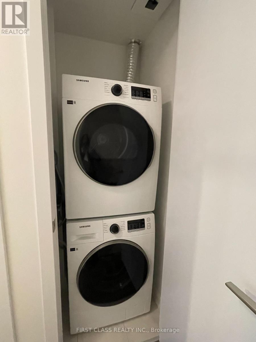 A washer and dryer stacked on top of each other in a small space.