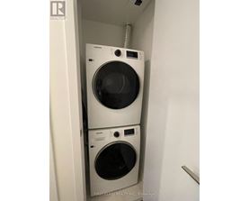 A washer and dryer stacked on top of each other in a small space.