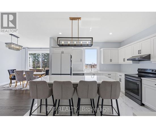A modern kitchen with a dining table set for four.