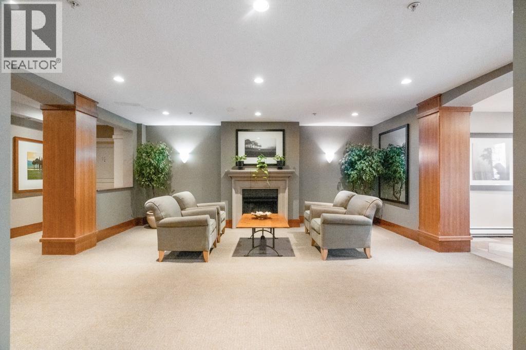 A living room with a fireplace and couches.
