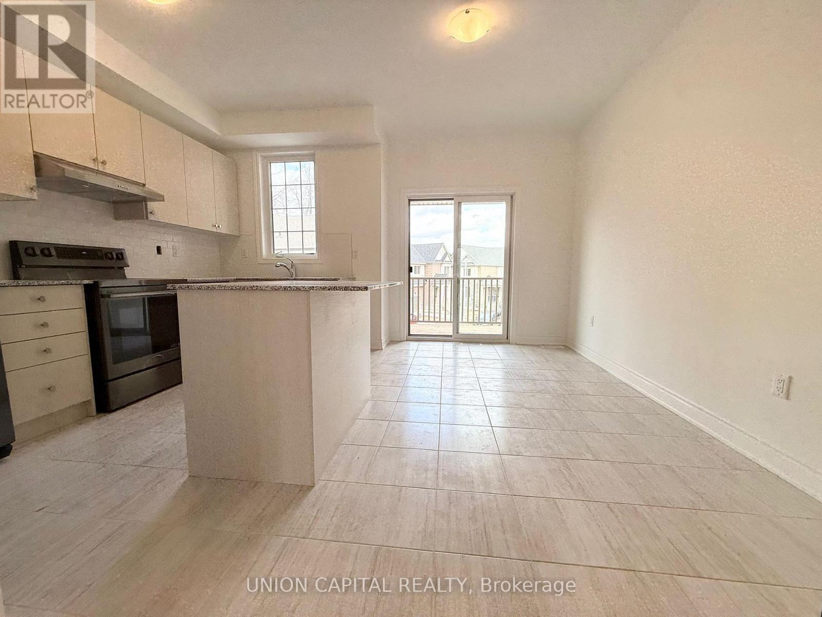 A kitchen with a stove top oven and a microwave.