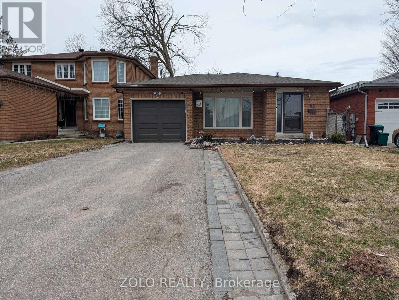A house with a driveway in front of it.
