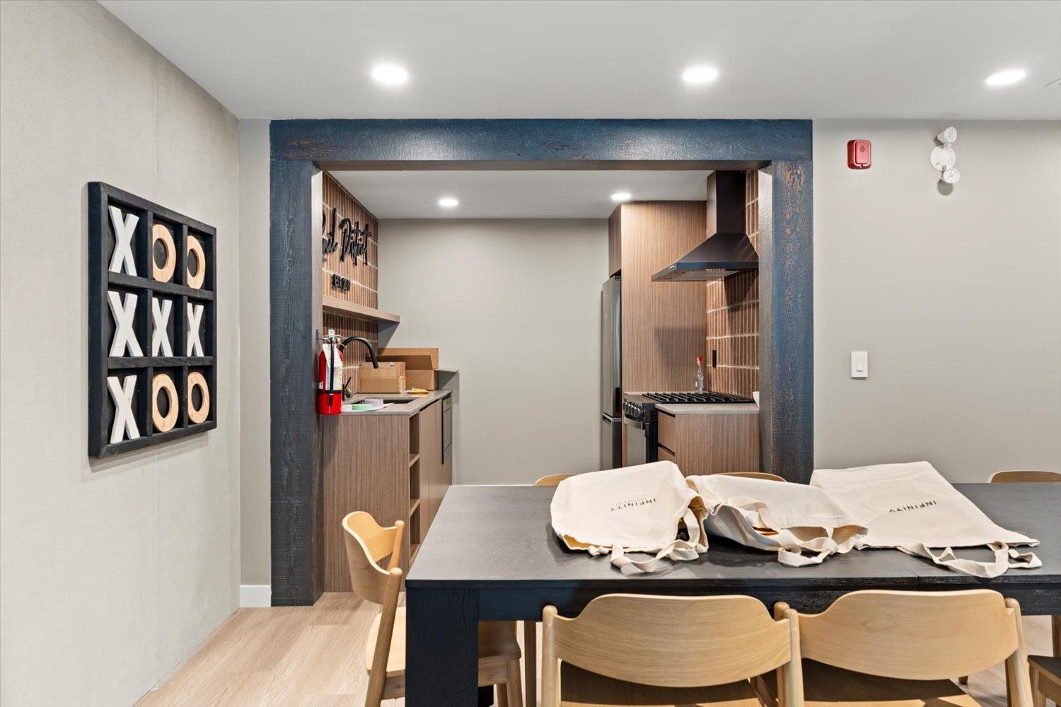 A dining area with a table and chairs.