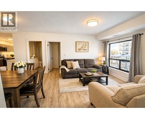 A well-lit living room with a dining table and a couch.