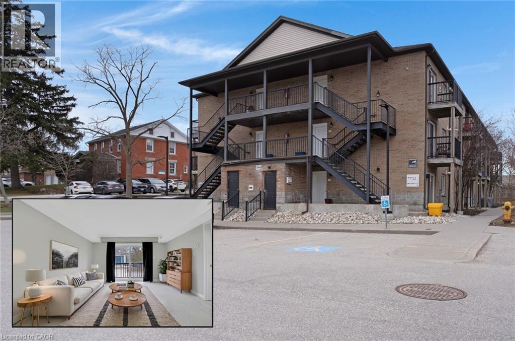 A building with a staircase and a fire hydrant in front.