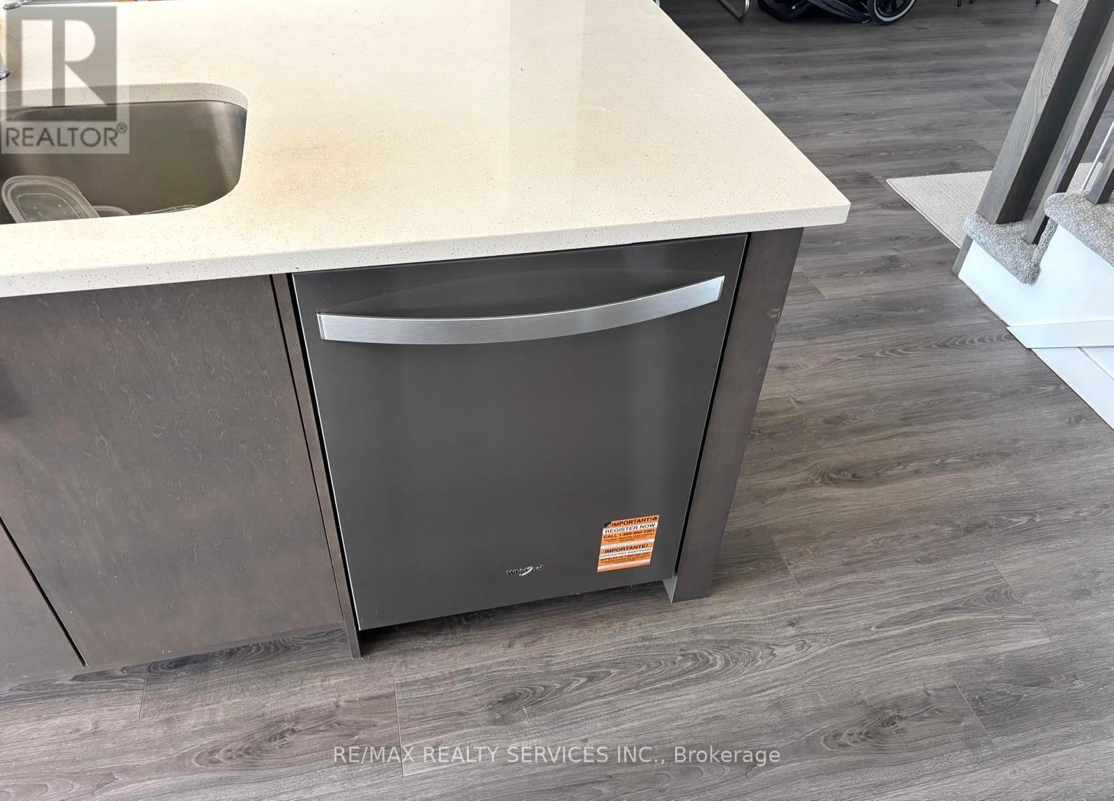 A modern kitchen with a dishwasher and a sink.