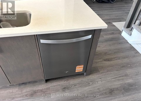 A modern kitchen with a dishwasher and a sink.