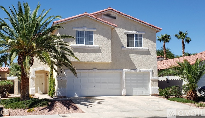 A house with a white garage door is for sale.