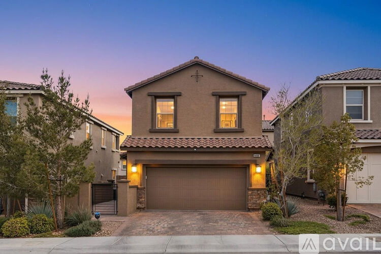 A house with a brown garage door is available for sale.