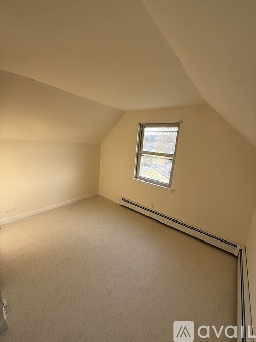 A room with a window and Avail logo on the floor.