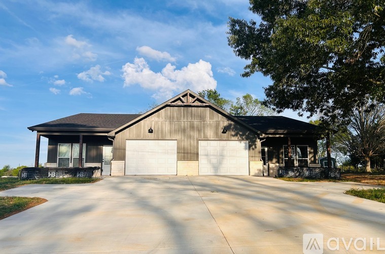 A large house with a garage is available for sale.