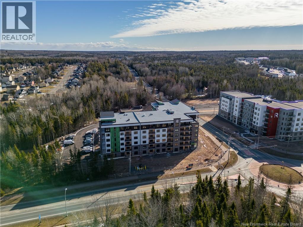 A realtor logo is visible on an aerial image of a residential area.