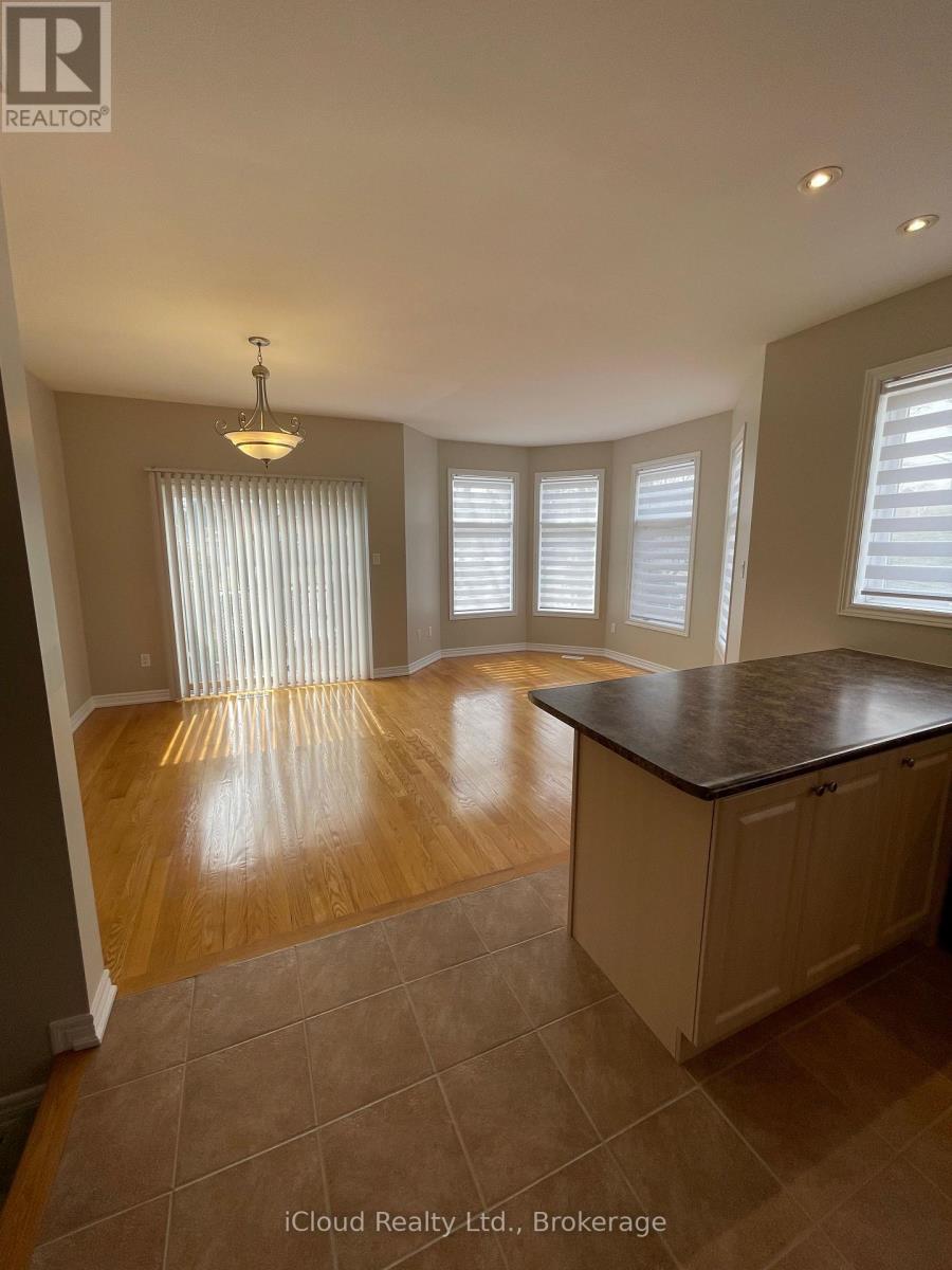 A kitchen with wooden floors and a large island.