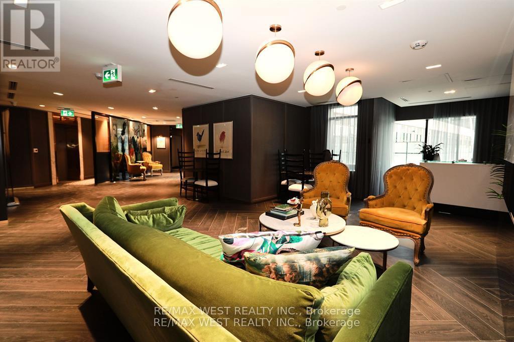 A living room with a green couch and a yellow chair.