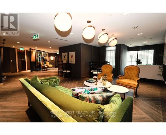 A living room with a green couch and a yellow chair.