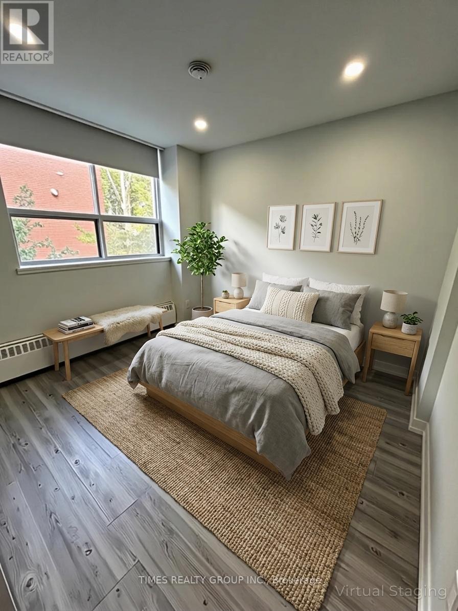 A bedroom with a large bed and a window.