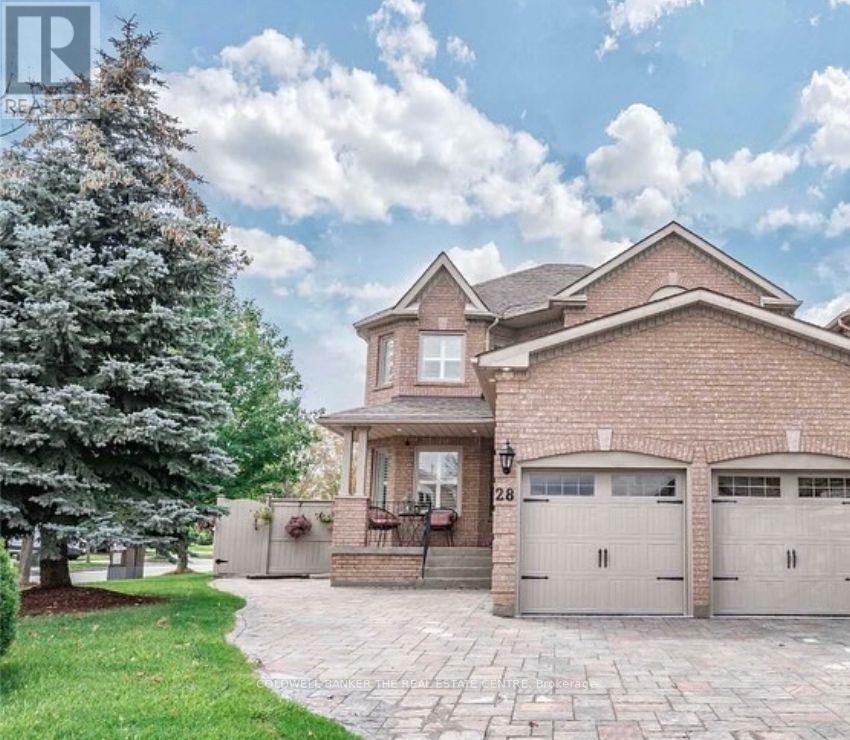 A house with a brick facade and a large driveway.