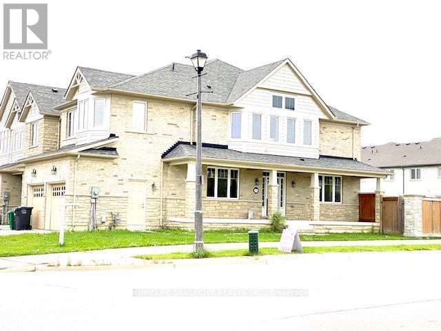 A large house with a brown door and a grey roof.