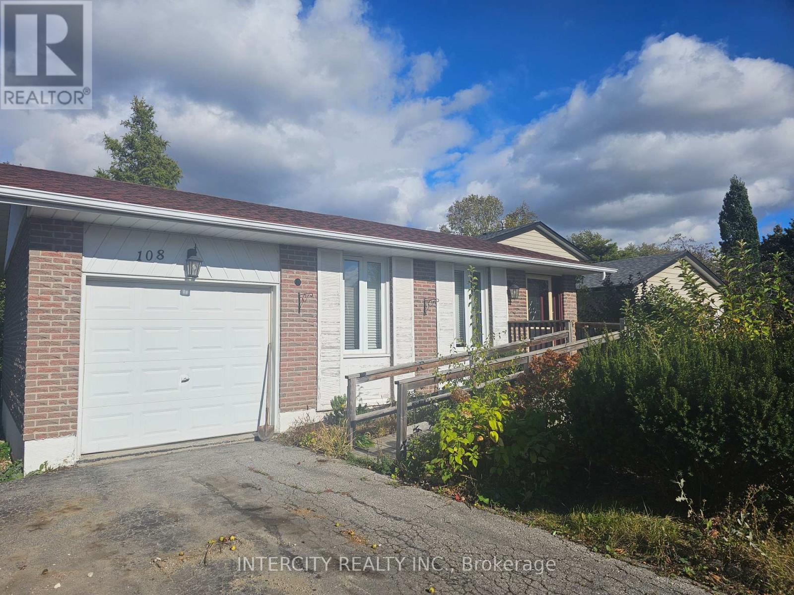A house with a white garage door is for sale.