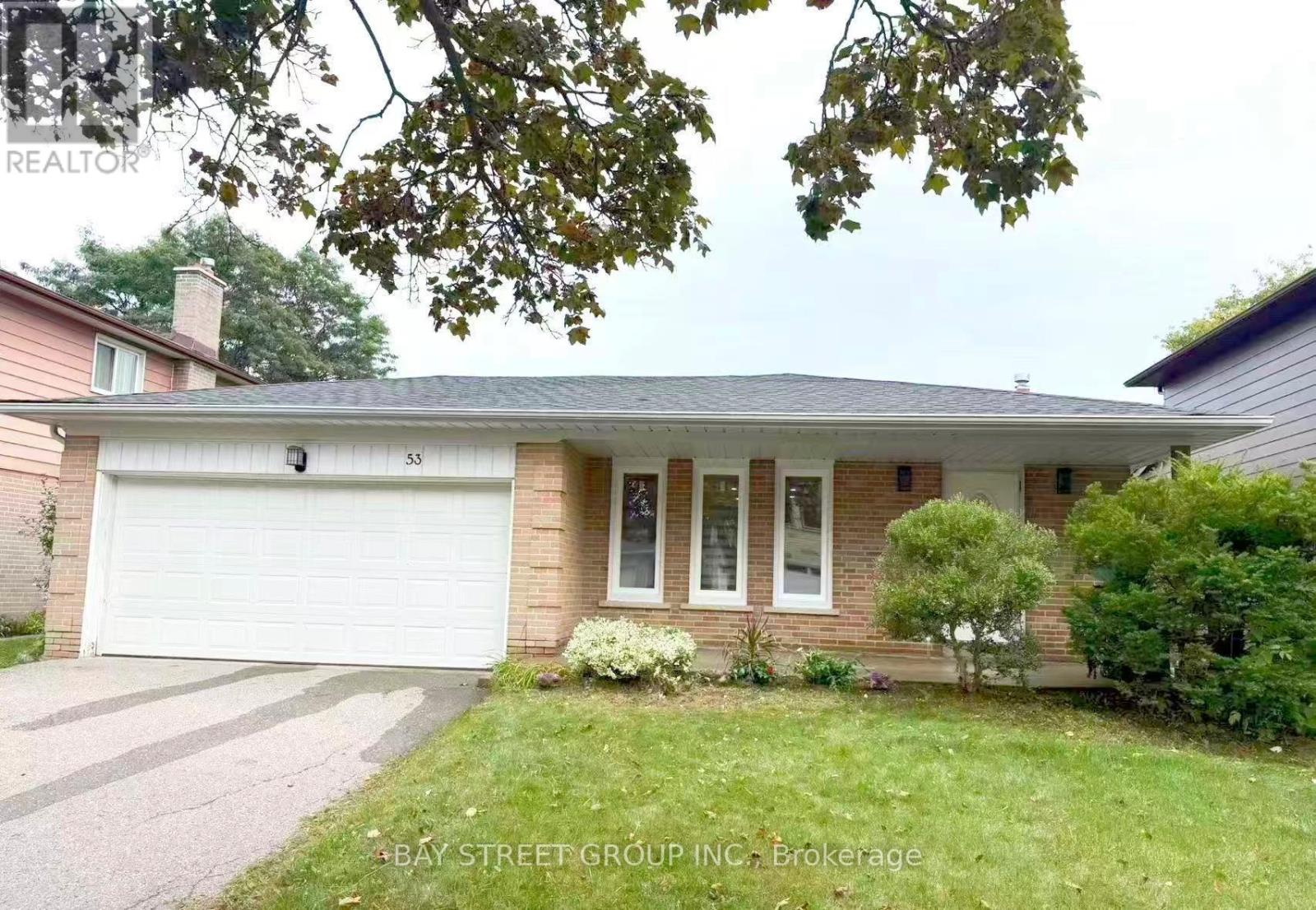 A house with a white garage door is for sale.