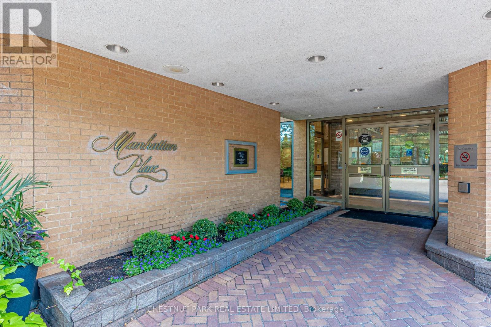 The entrance to a building with a sign that says "Marble Plate".