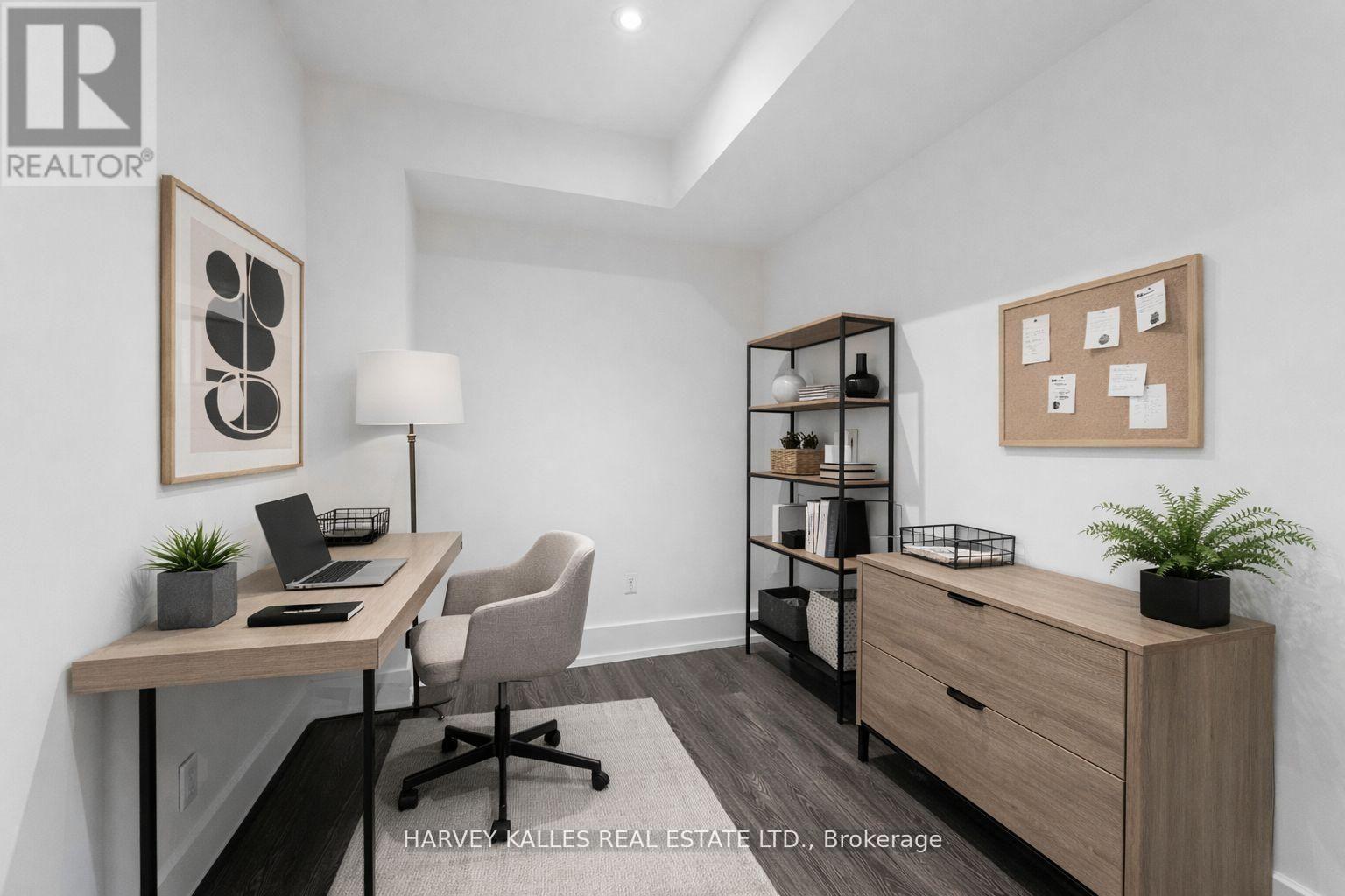 A well-lit office space with a desk, chair, and shelving unit.