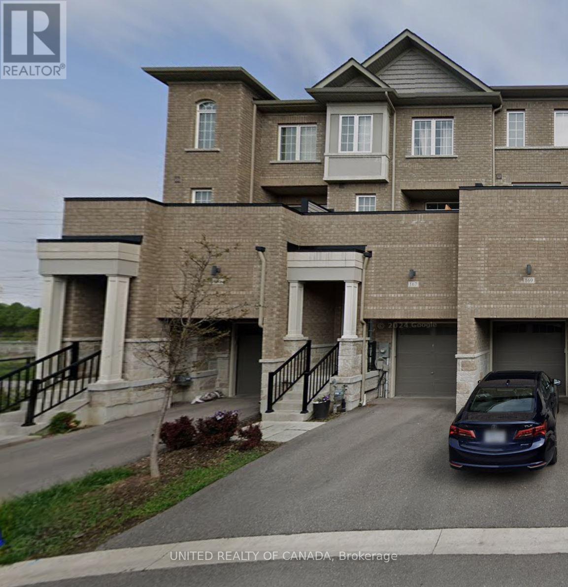 A house with a car parked in front of it.