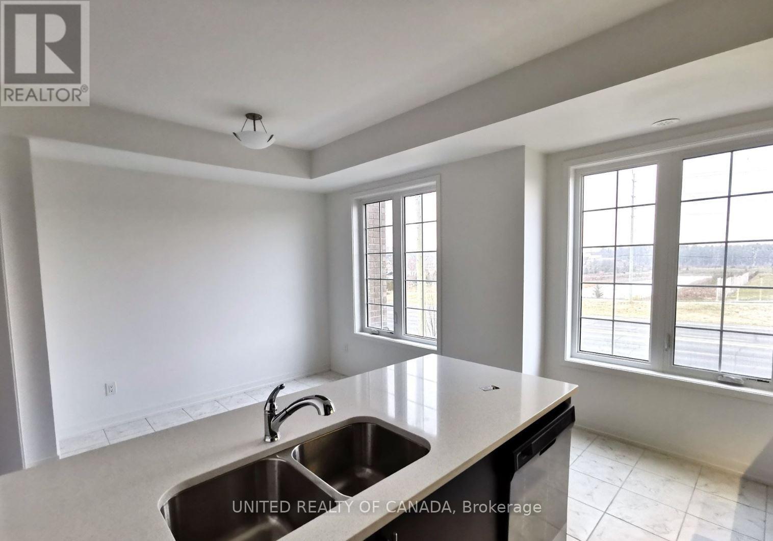 A kitchen with a sink and a window.