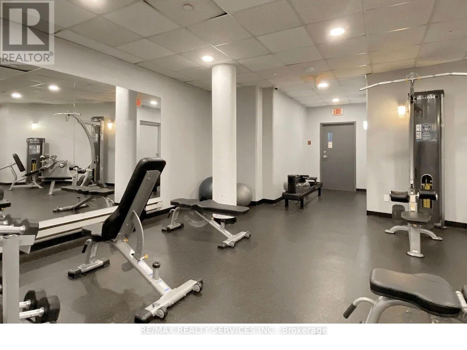A gym with a variety of equipment including a leg press machine.