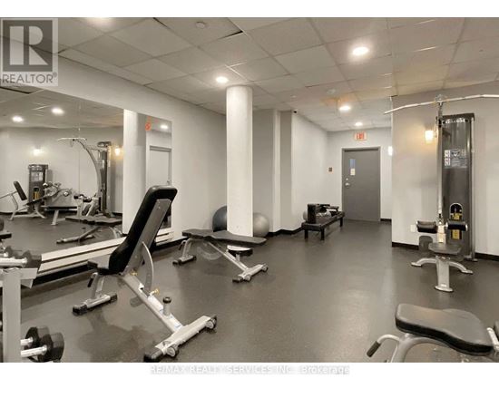 A gym with a variety of equipment including a leg press machine.