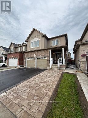 A house with a driveway in front of it.