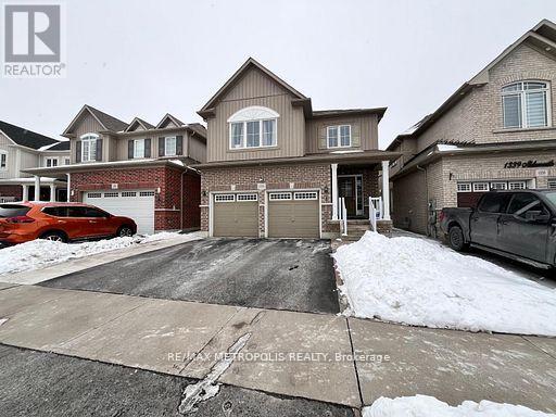 A real estate photo shows a house with a driveway and garage.