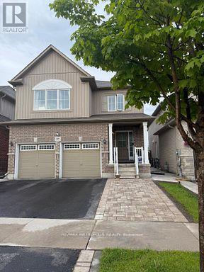 A two-story house with a garage is shown in the image.