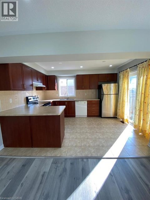 A kitchen with wooden cabinets and a countertop.